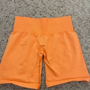 NVGTN orange pro shorts